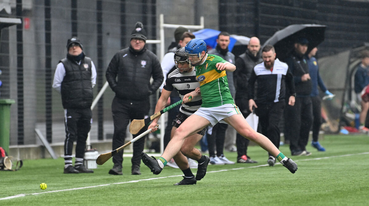 Midleton's Mikey Finn and Shandrum's Jack Hogan battle for possession. Picture: Dan Linehan