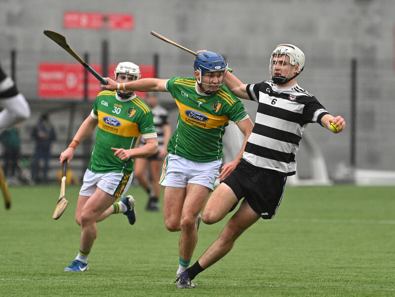 Cárthaigh Cronin of Midleton holding off Shandrum's Bobby Carroll. Picture: Dan Linehan