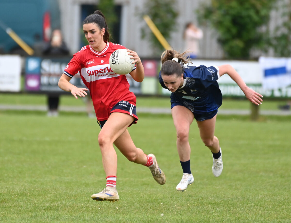 Cork's Erika O'Shea bursting past Waterford's Kellyann Hogan. Picture: Eddie O'Hare