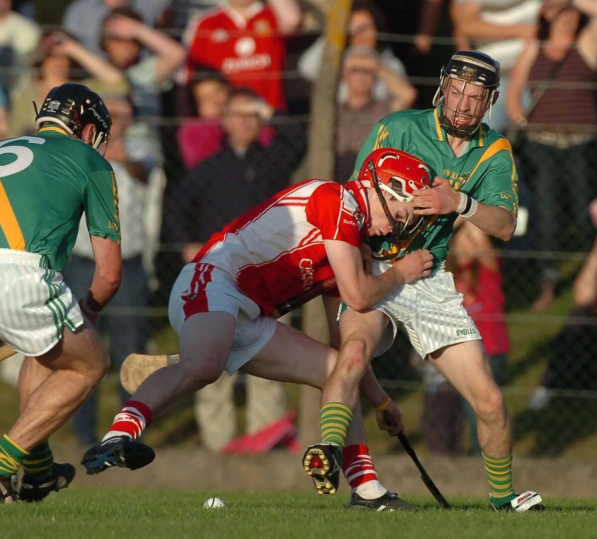 Castlemartyr's Barry Lawton losing his helmet to Dungourney's Eoin Ahern. Picture: Richard Mills