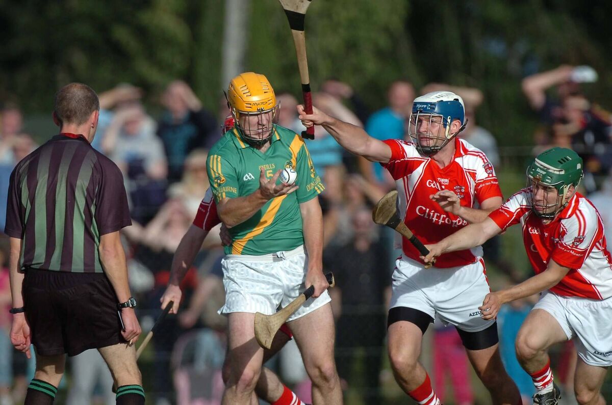 Dungourney's John Ronayne making a handpass as Castlemartyr's Darragh O'Keeffe and Barra O'Tuama rush in to block him. Picture: Richard Mills