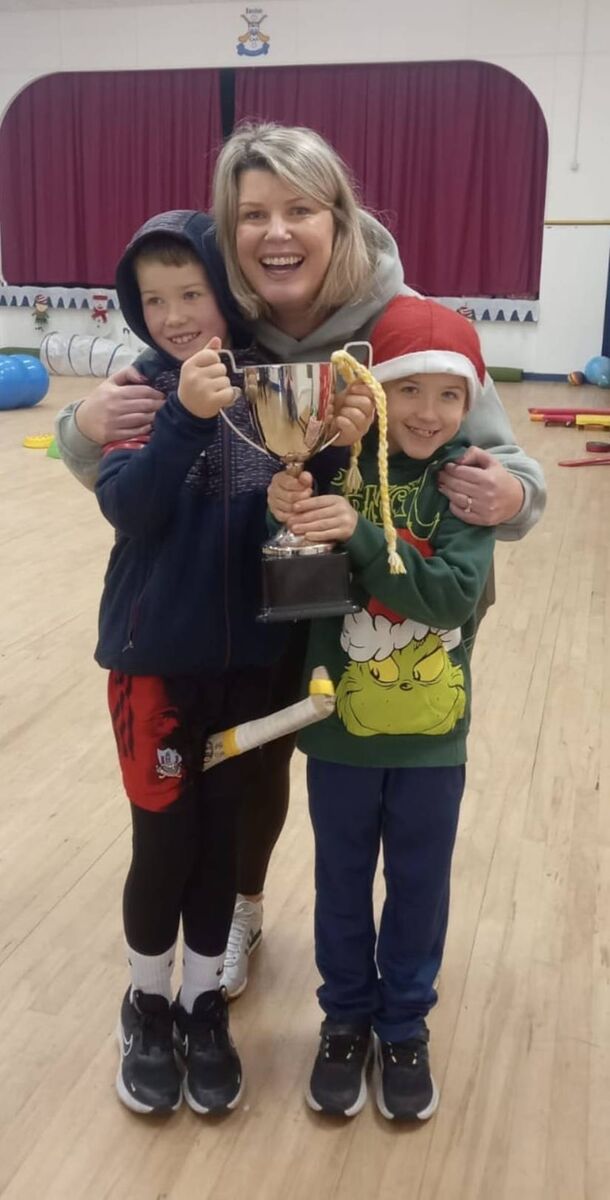 Patrick and Charlie Nyhan, Bandon GAA All-Stars with co-ordinator Liz Gleeson and the cup presented to the All Stars by GAA President Jarlath Burns.