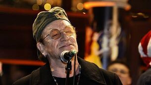 Bono joins annual Dublin city centre Christmas Eve busking session