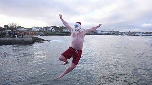 Crowds brave chilly temperatures for Christmas Day swim Crowds brave chilly temperatures for Christmas Day swim