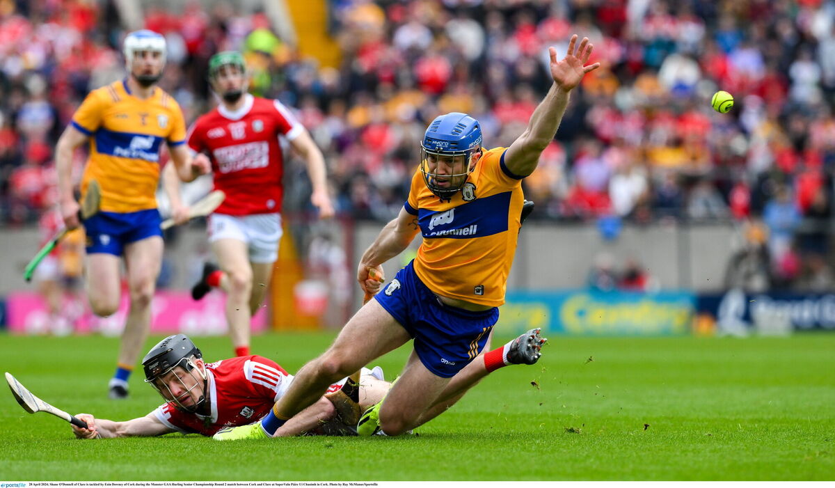 Shane O'Donnell of Clare is tackled by Eoin Downey. Picture: Ray McManus/Sportsfile
