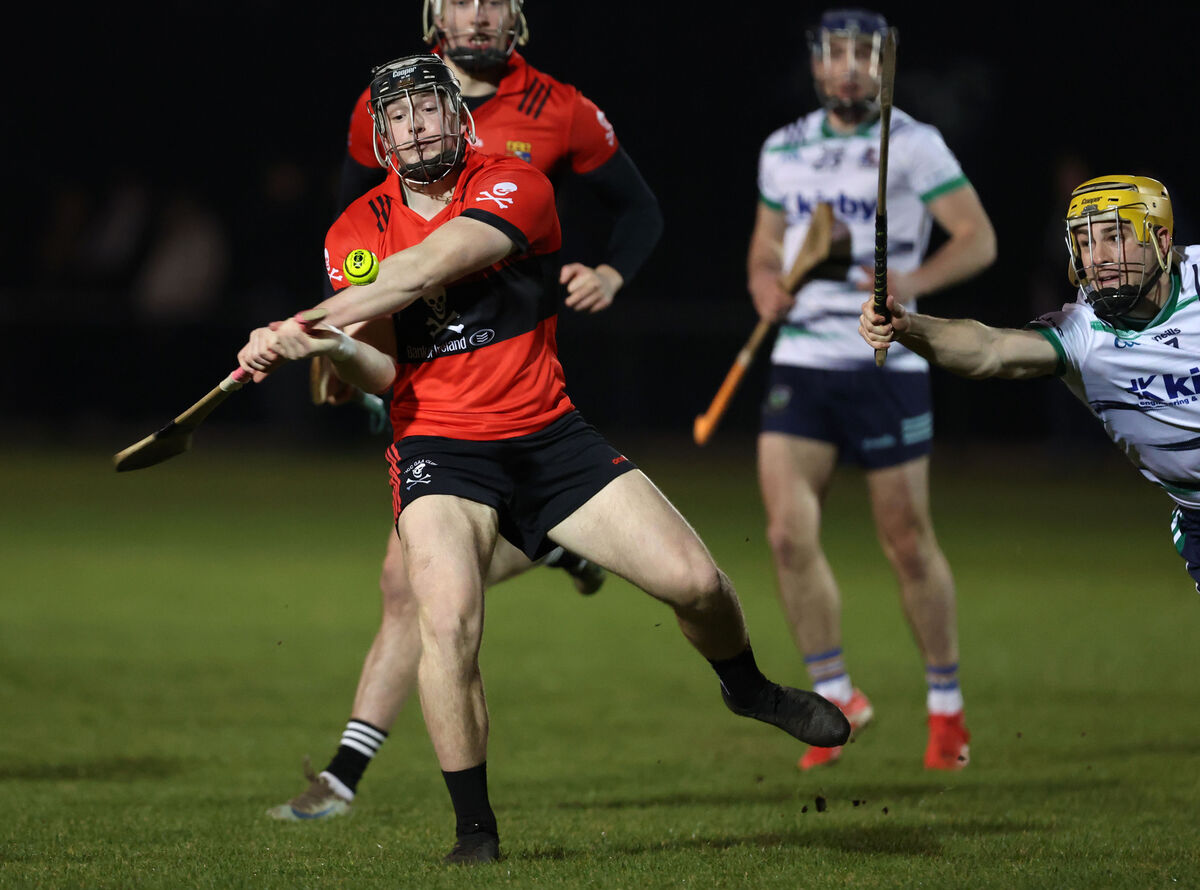  Finn O'Brien, UCC, shoots from Ian Shanahan, UL. Picture: Jim Coughlan.