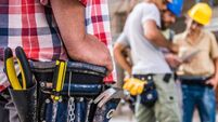 Worker wearing tool belt