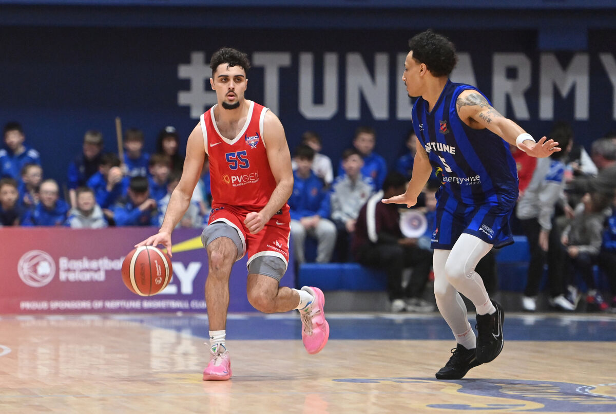  Daryl Cuff, UCC Demons, looking to go past Samuel Henderson, Neptune. Picture: Dan Linehan