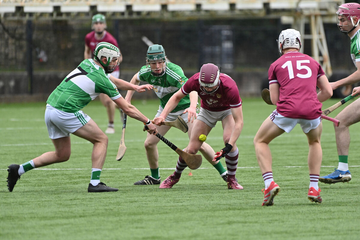  Darragh Griffin, Bishopstown, about to pick up under pressure from Aghabullogue players Ciaran Thompson and Brendan O'Sullivan. Picture: Dan Linehan