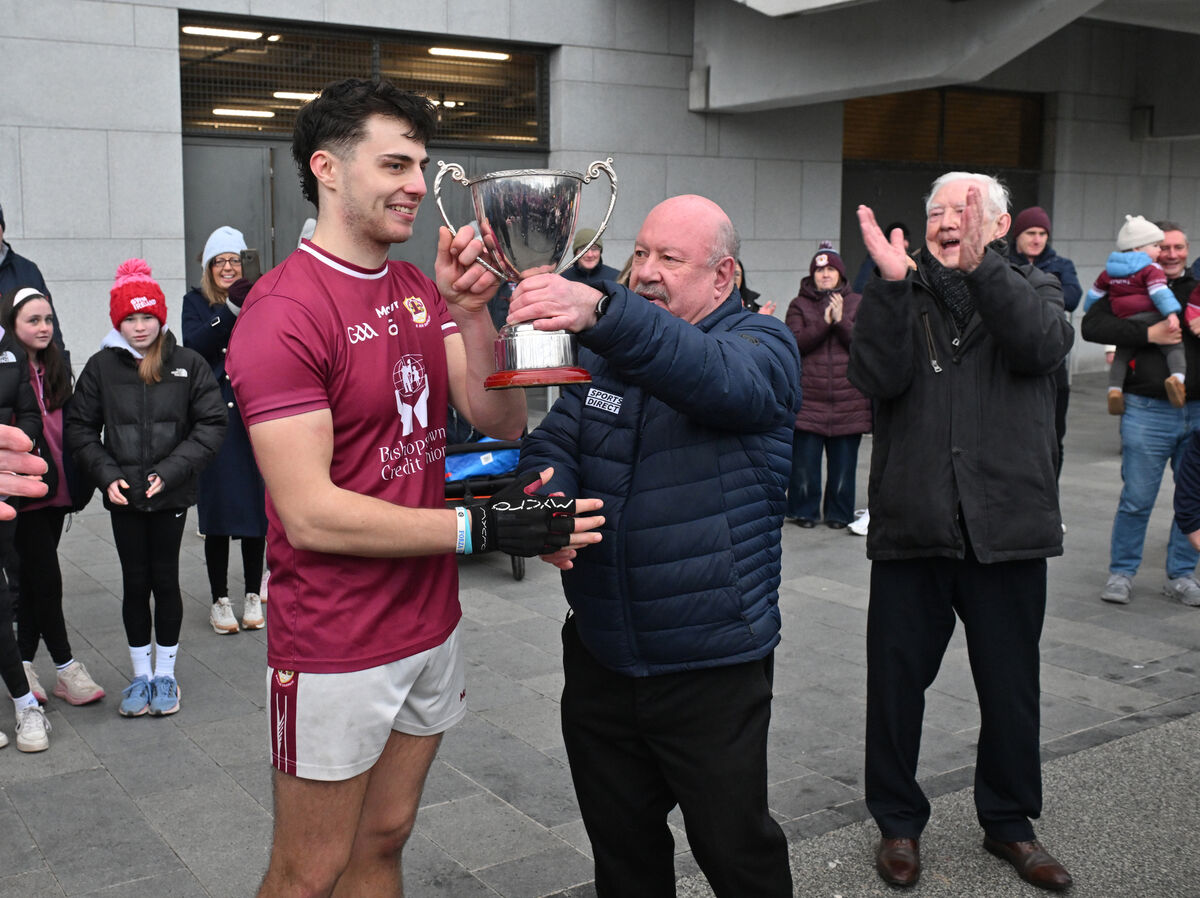 Bishopstown captain Daire Daly is presented with the trophy from Cork County Board officer Tony McAuliffe. Picture: Dan Linehan Bishopstown captain Daire Daly is presented with the trophy from Cork County Board officer Tony McAuliffe. Picture: Dan Linehan