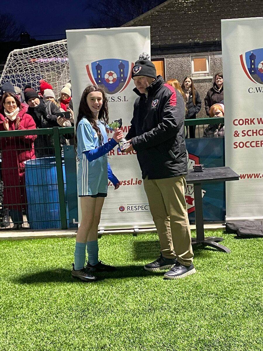 Avondale's Maia Lolonga, who was the player of the match in the CWSSL U14 bowl final receives her trophy from Brian Murphy, CWSSL.