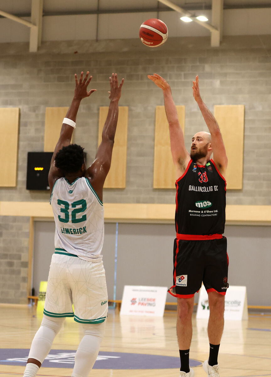  Keelan Cairns, Ballincollig, shoots for a three, under pressure from Sean QAntonio Hauser Jnr, Limerick Celtics. Picture: Jim Coughlan.