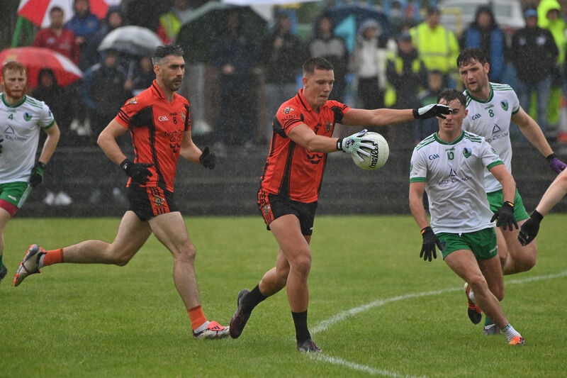  Darragh Cashman, Duhallow about to be blocked down by Aaron O'Sullivan, Muskerry in the Premior Senior Football Championship Divisions/Colleges final at Ballydesmond in 2025. Picture: Dan Linehan