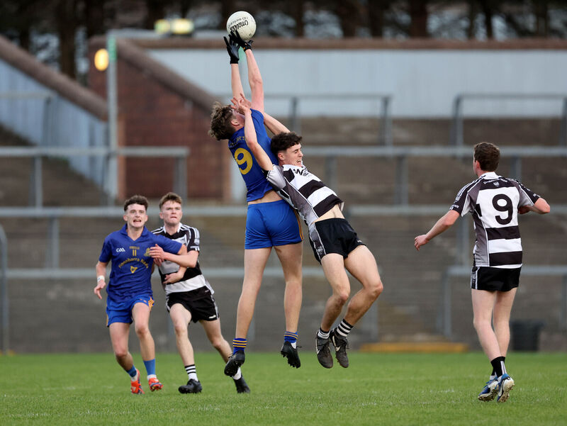  Dan O'Keeffe, St. Finbarrs and Daniel Golden, Donoughmore battle for the aerial ball during their Premier 2 Minor Football Championship Final at Pairc Ui Rinn. Picture: Jim Coughlan.