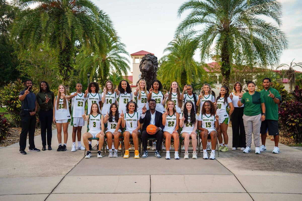 Amy Duggan with her new teammates and coaches from Saint Leo University where she will be playing this season.