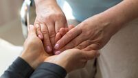 Hands of a mature woman or caregiver of care and support. Close-up.
