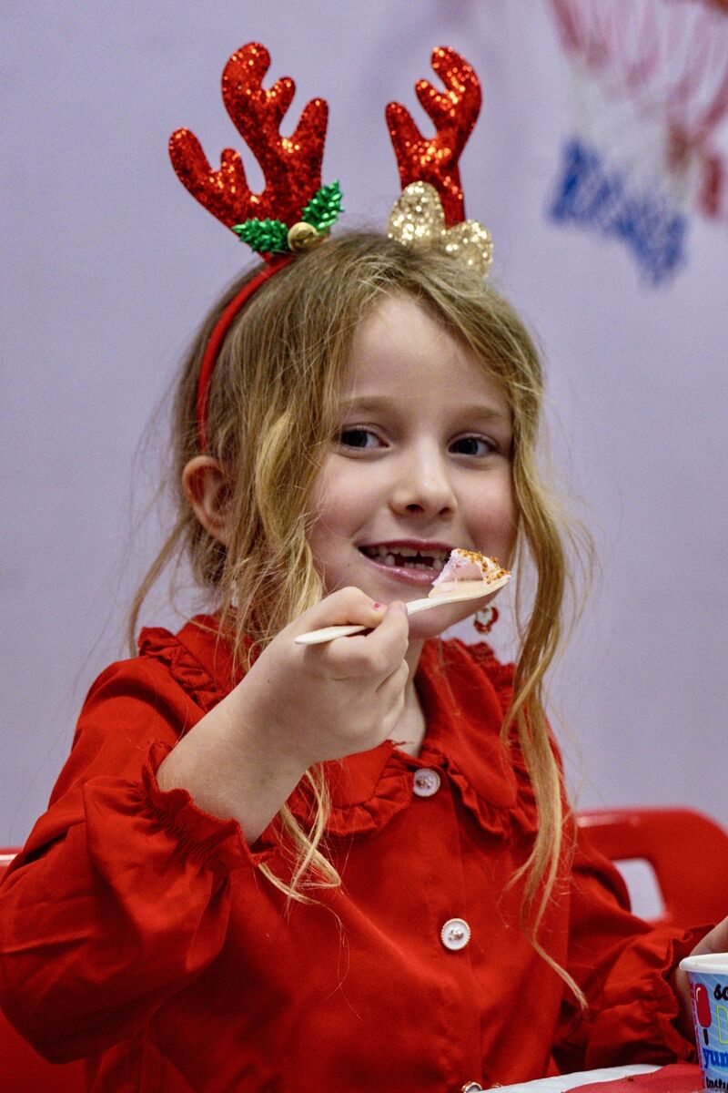 Asha Griffin tucks into the ice cream, her favourite part of the Christmas dinner at Scoil Maria Assumpta in Ballyphehane.