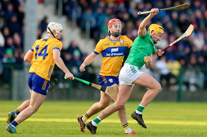 Cathal O'Neill of Limerick is tackled by Darragh Lohan and Keith Smyth of Clare in their Munster Hurling League clash at Tulla. Picture: ©Inpho/Natasha Barton Cathal O'Neill of Limerick is tackled by Darragh Lohan and Keith Smyth of Clare in their Munster Hurling League clash at Tulla. Picture: ©Inpho/Natasha Barton