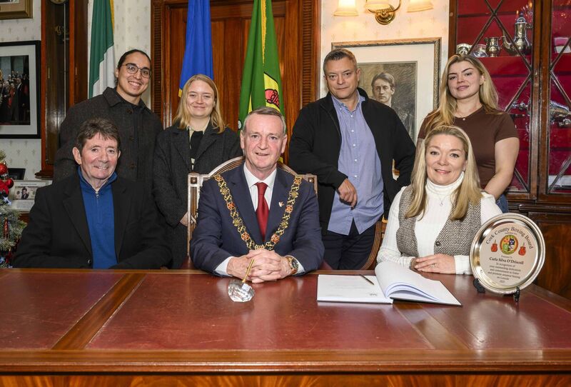 Cork County Boxing Board Awardee Carla Silva-O’Driscoll pictured with Lord Mayor Cllr Fergal Dennehy and members of her family whilst signing the visitors book during the recent presentation at Cork City Hall. Picture: Doug Minihane