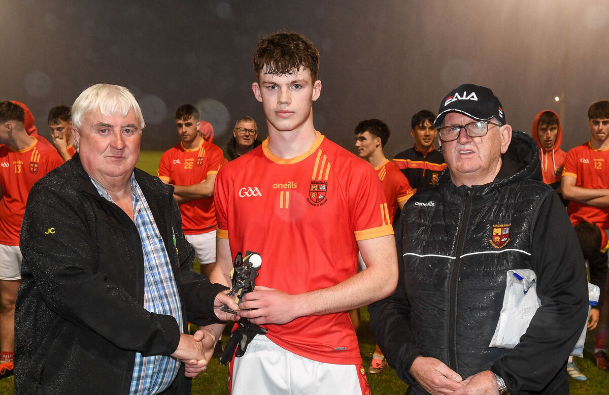  John Courtney, Avondhu Division chairman, presents the man of the match award to Mallow's Ben O'Shea after they defeated Kilshannig in the Avondhu U21 A Football Championship final in 2025. Also included is division secretary Mick Murphy. Picture: David Keane.