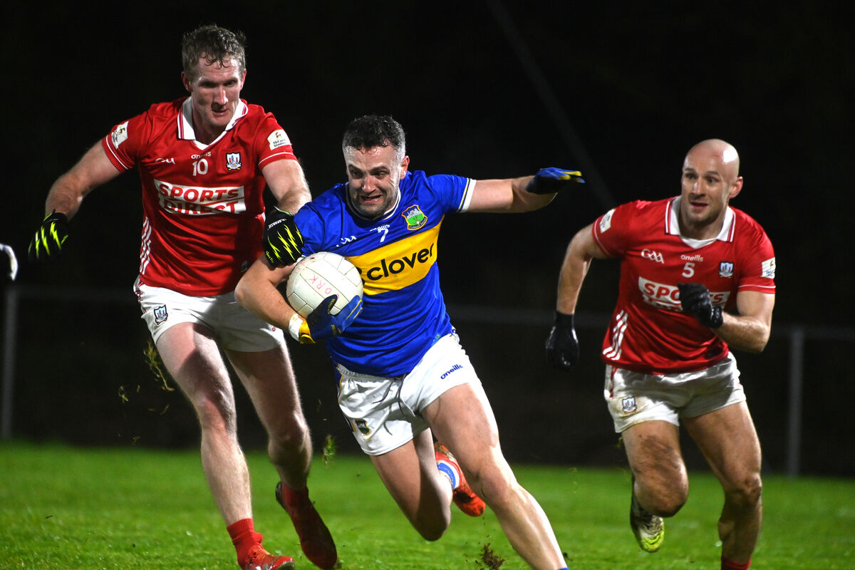  Ruairi Deane of Cork keeps the pressure on Luke Boland of Tipperary. Picture: Larry Cummins