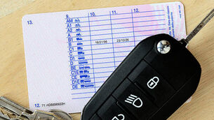 1809182941 Driving license with car key