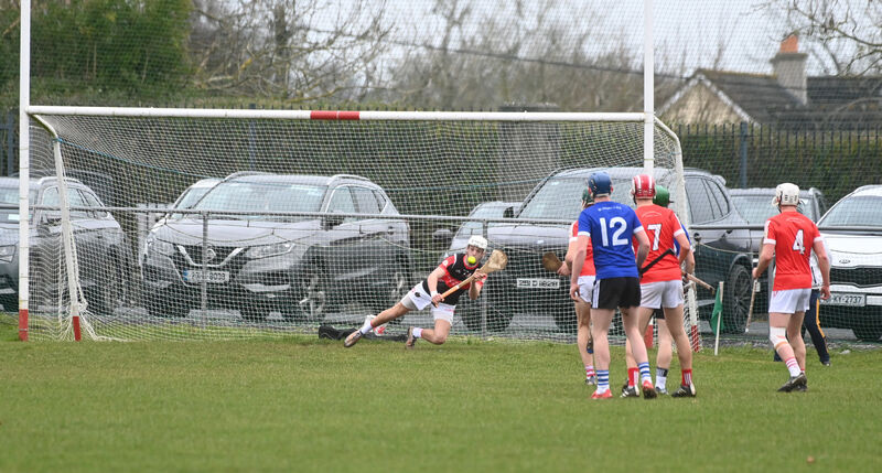  Midleton CBS goalkeeper Tom C Walsh eyes the sliothar but is beaten from a penalty from Eoghan Doughan. Picture: Larry Cummins