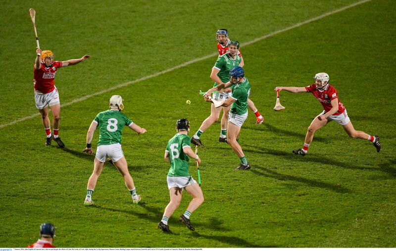 John English of Limerick has a shot on goal despite the efforts of Colm McCarthy of Cork. Picture: Brendan Moran/Sportsfile John English of Limerick has a shot on goal despite the efforts of Colm McCarthy of Cork. Picture: Brendan Moran/Sportsfile