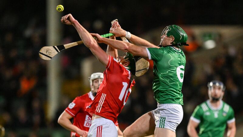 Colin O’Brien of Cork and Will O'Donoghue of Limerick contest a dropping ball. Picture: Brendan Moran/Sportsfile