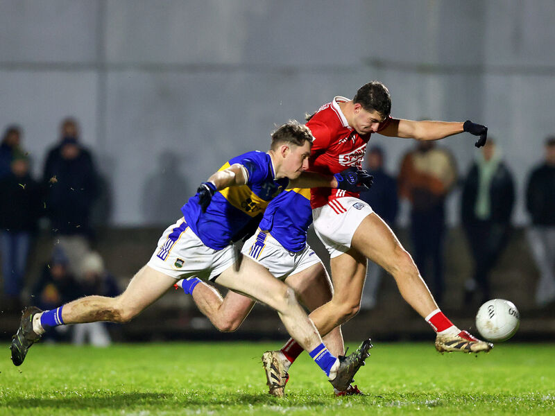 Cork’s Sean McDonnell shoots from Eoin O'Connell and Emmet Moloney of Tipperary. Picture: INPHO/Tom O’Hanlon