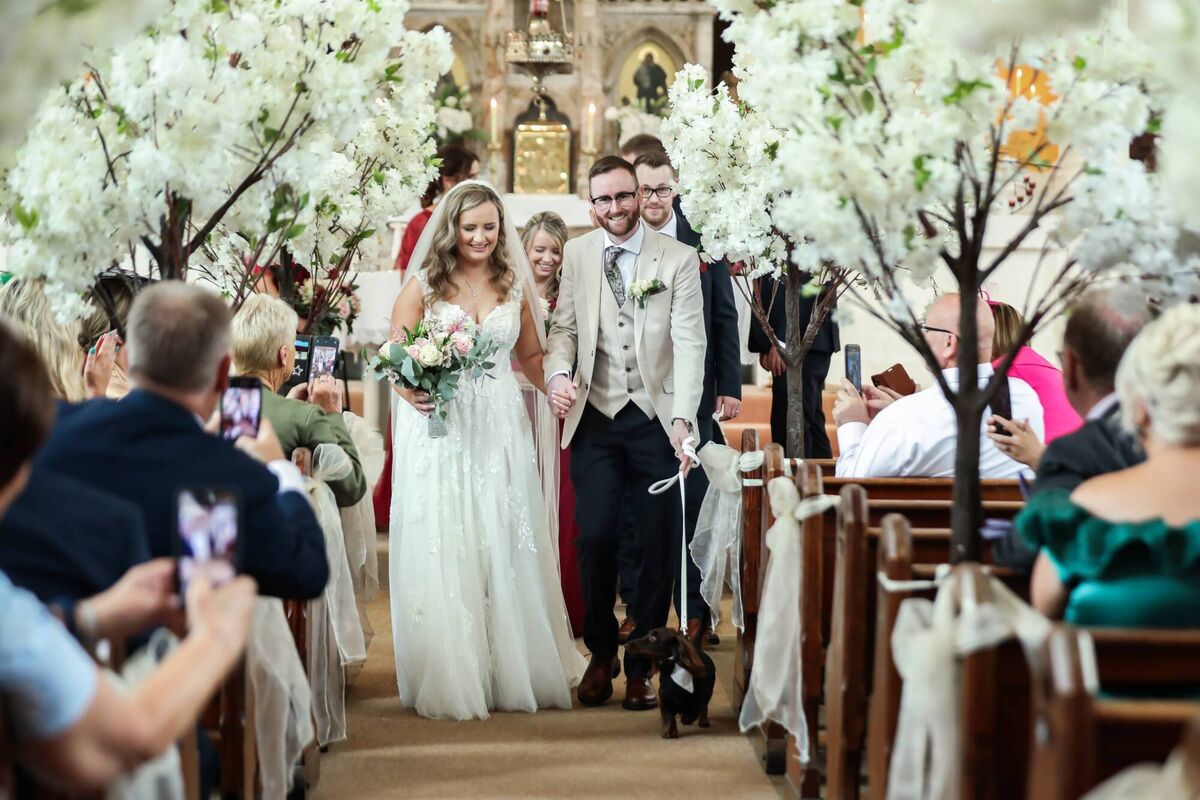 Megan and Paul’s mini Dachshund served as ring bearer on the day.