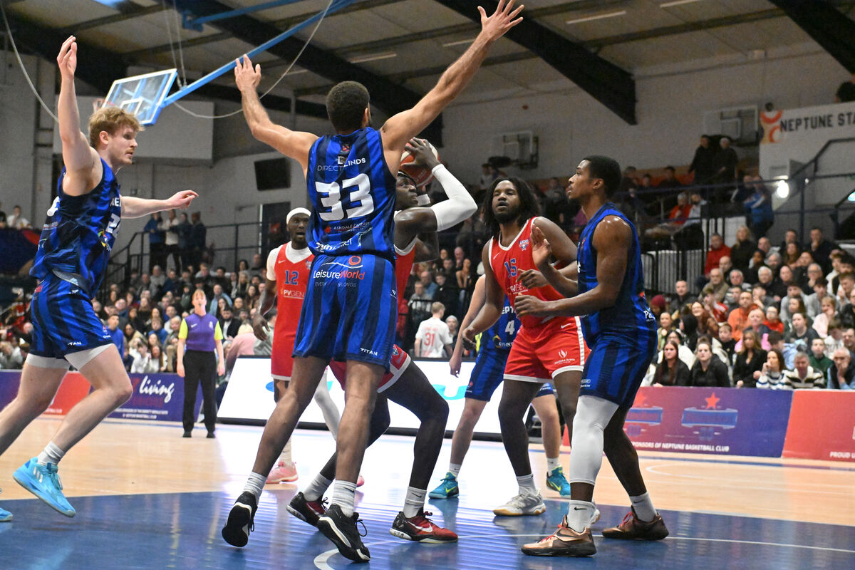  Tala Fam Thiam, UCC Demons, is blocked by Adon Gregorio of Neptune. Picture: Dan Linehan