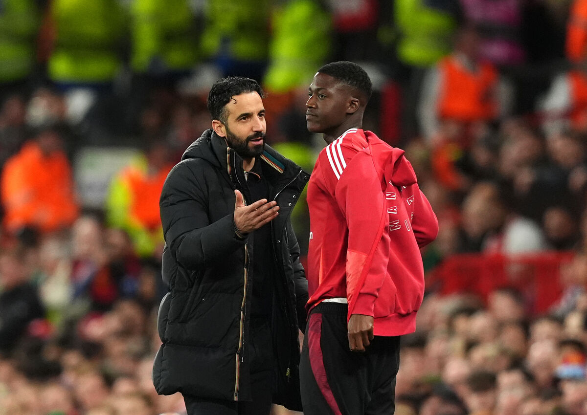 Manchester United manager Ruben Amorim instructs Kobbie Mainoo on the touchline during the UEFA Europa League quarter-final, second leg match at the Old Trafford in Manchester, England.
