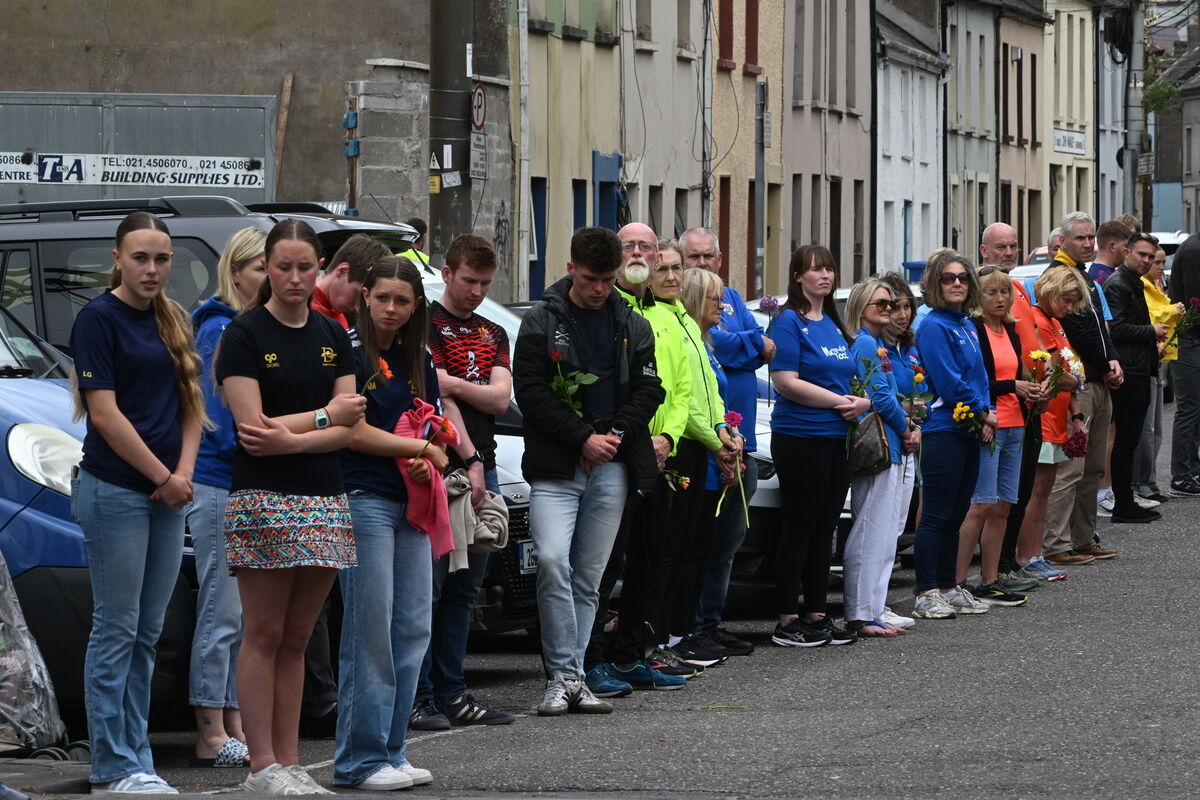 The guard of honour by running and swimming clubs after the funeral Mass for Ellen Cassidy, inset, at the Church of the Annunciation, Blackpool. A fundraising event in her memory will be held today. Picture: Larry Cummins.