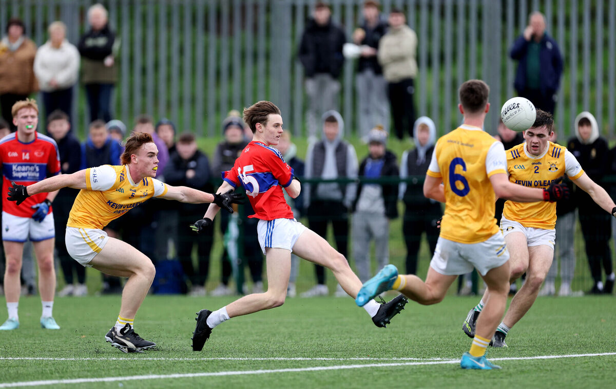  Loughlin O'Donnell, Ben Coffey and Hugo Woods, Hamilton High School, cannot stop the shot of Adam O'Neill, IS Killorglin during their Corn Uí Mhuirí clash at Bishopstown. Picture: Jim Coughlan.