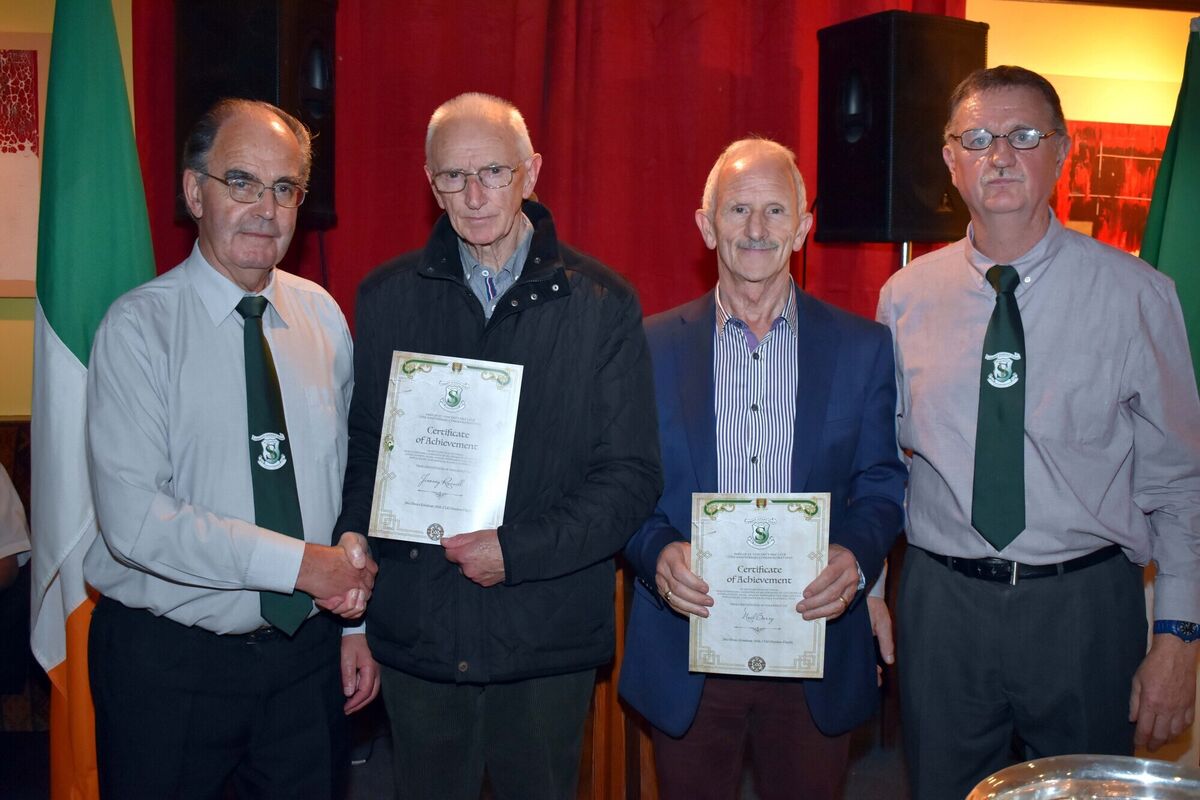 Jimmy Russell and Noel Barry receive their 75th Anniversary Certificates of Achievement from William Leahy and William McCarthy at the St Vincent's GAA function honouring those players who played with Cork down through the years.