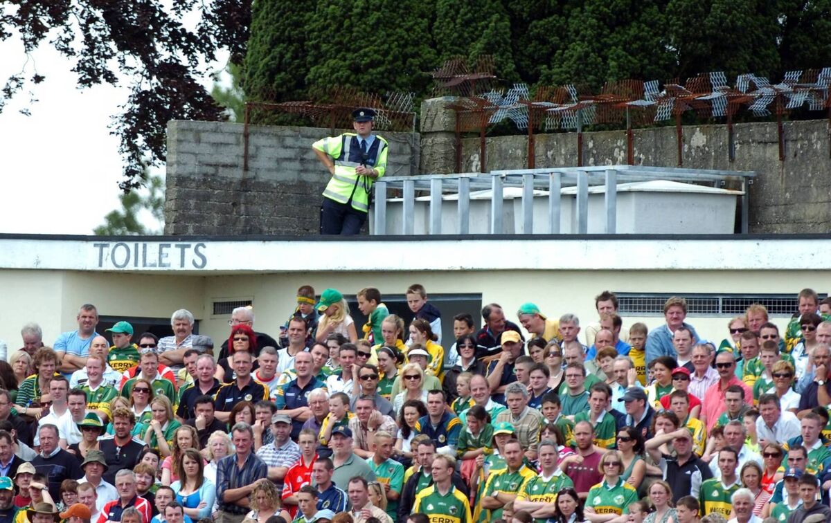 A Garda keeps an eye on Kerry and Cork in the Munster SFC final in Killarney. Picture: Eddie O'Hare