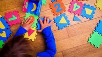 little girl playing with puzzle, early education