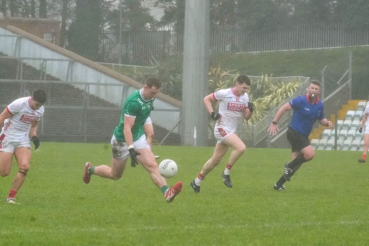 Barry Coleman of Limerick solos past David Buckley. Picture: Noel