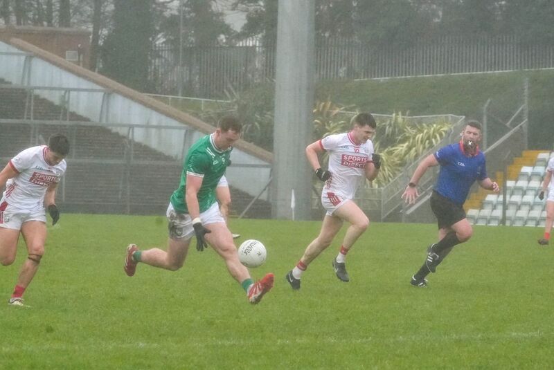 Barry Coleman of Limerick solos past David Buckley. Picture: Noel