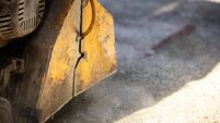 Close up view of circular construction machine cutting asphalt or concrete. Road maintenance and construction.