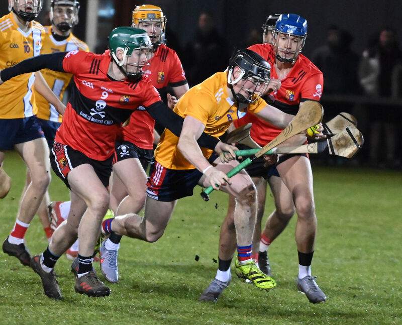 MTU Cork's Joe Egan breaks from UCC's Colin Walsh and Darragh Stakelum. Picture: Eddie O'Hare