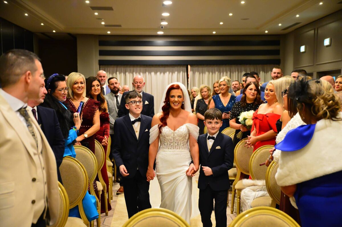 Karen’s father walked her down the aisle, with her sons meeting her halfway.