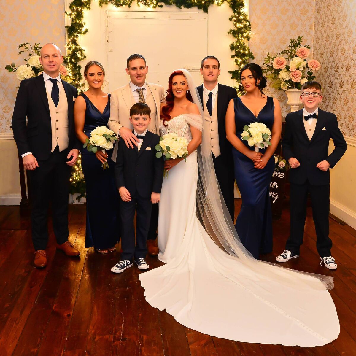 Karen and Paul pictured with their bridal party including their three children.