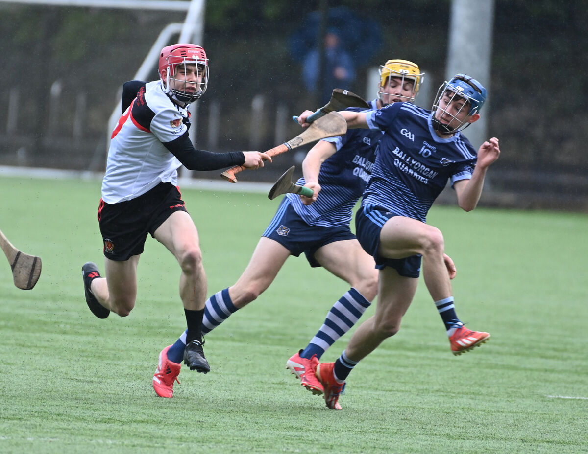 Coláiste Spioraid Naoimh's Eli McKeown breaks past Sean Flanagan. Picture: Eddie O'Hare