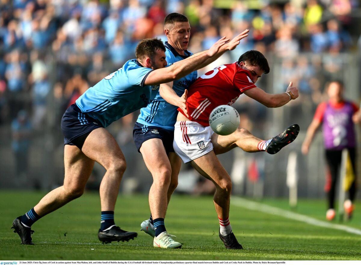 Chris Óg Jones of Cork in action against Sean MacMahon and John Small of Dublin. Picture: Daire Brennan/Sportsfile