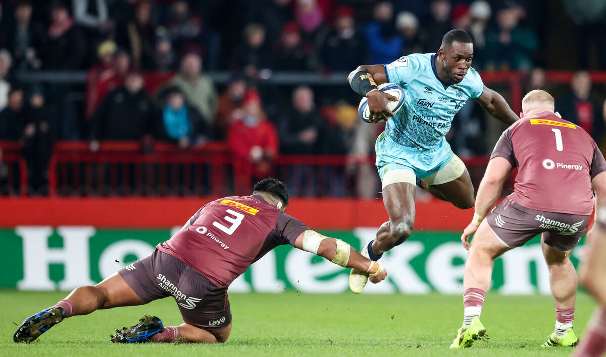 Castre Olympique's Christian Ambadiang is tap-tackled by Michael Ala'alatoa of Munster. Picture: INPHO/Nick Elliott