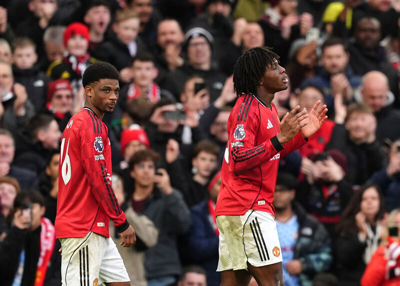 Manchester United's Patrick Dorgu (right) celebrates scoring their second goal. Picture: Martin Rickett/PA Wire.