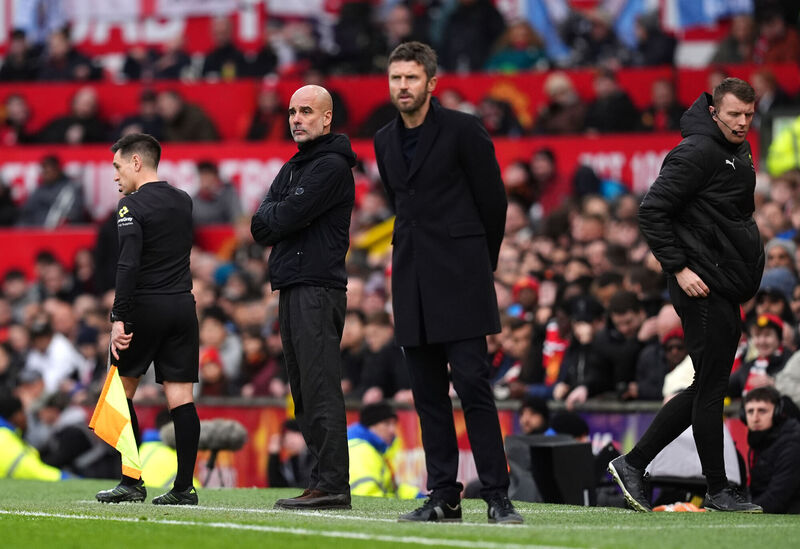 Manchester City manager Pep Guardiola and Manchester United interim head coach Michael Carrick on the touchline. Picture: Martin Rickett/PA Wire.
