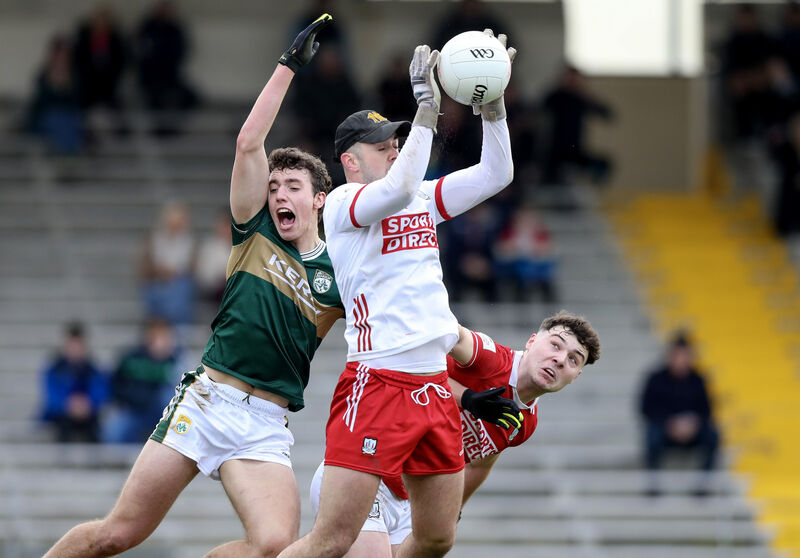 Cork’s Patrick Doyle claims the ball ahead of Daniel O’Mahony and Kerry’s Tomas Kennedy. 